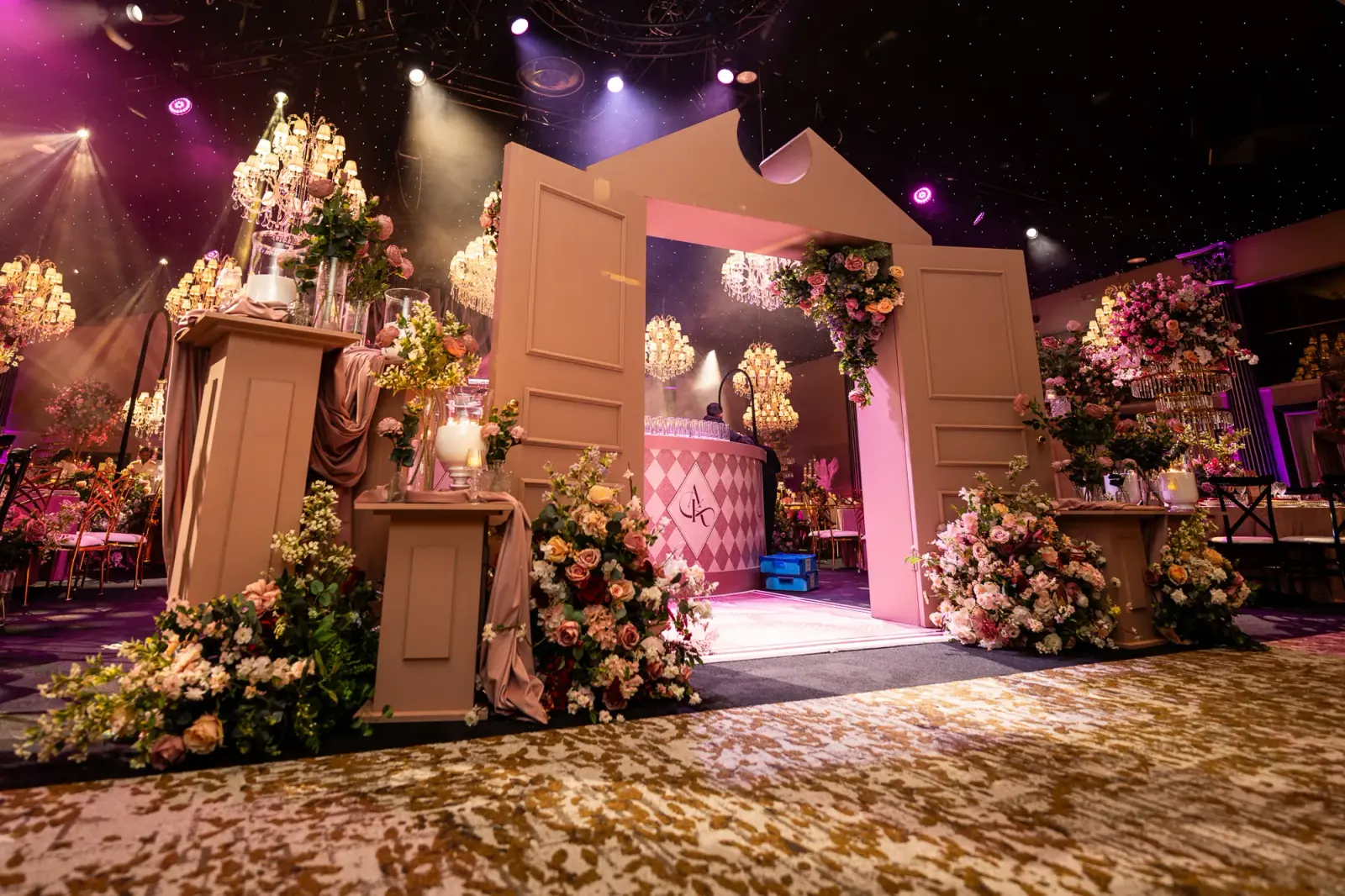 Floral entrance set framing a view of the pink wedding bar | Dallas Burston Polo Club Floral entrance set framing a view of the pink wedding bar at Dallas Burston Polo Club