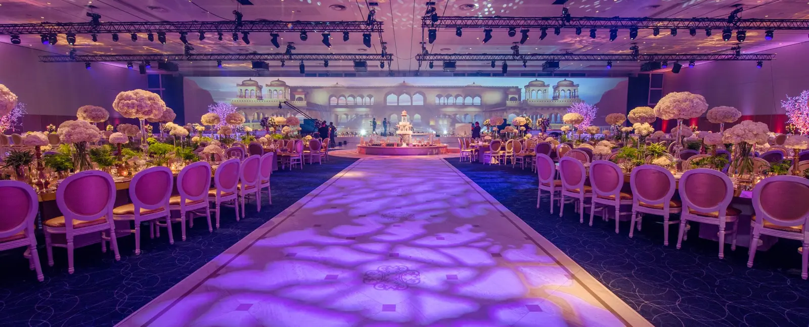 Patterned purple light along the central wedding walkway at InterContinental O2