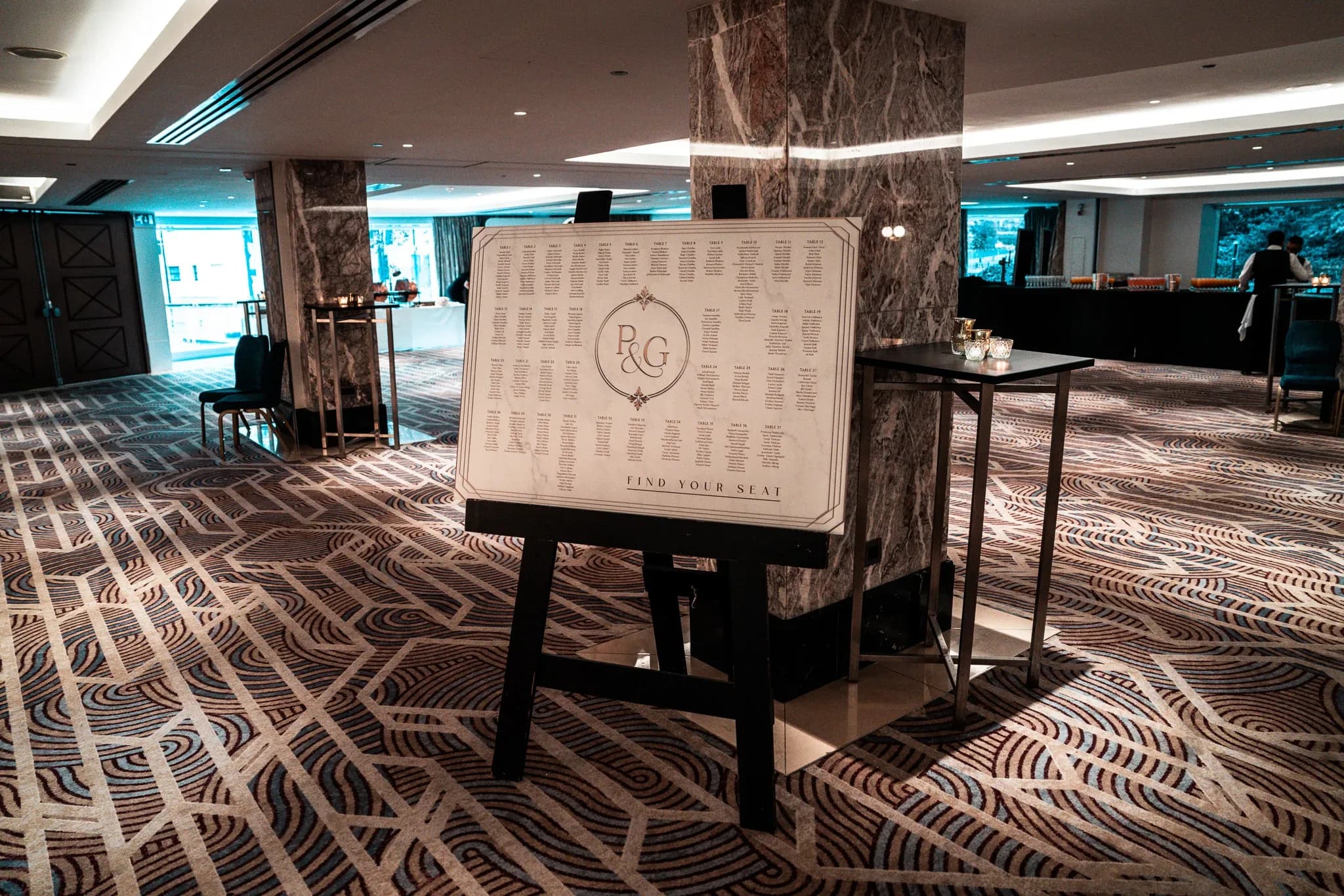 Find your place | Royal Lancaster London | Kudos Music A printed seating plan welcomes guests to Pooja and Gary’s wedding reception at Royal Lancaster London.