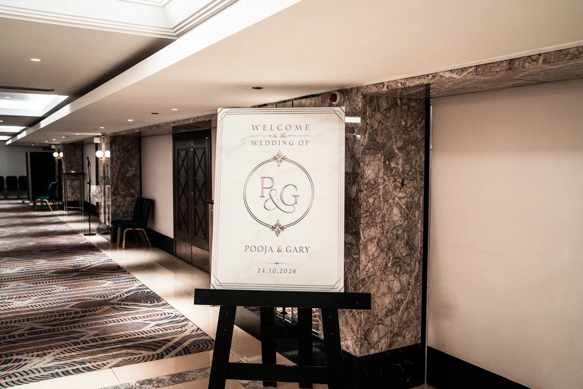 Welcome to Pooja & Gary’s wedding | Royal Lancaster London | Kudos Music Pooja and Gary’s personalised welcome sign beside the entrance to their Royal Lancaster London reception.