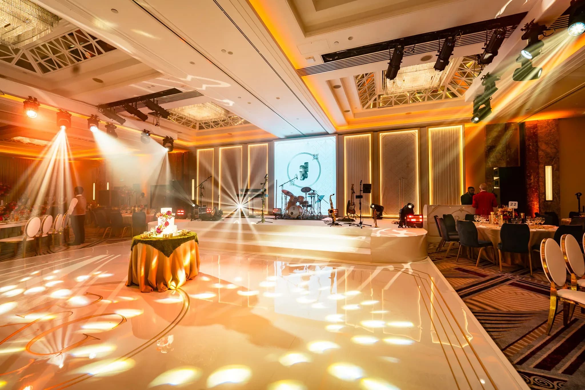 A floor ready for dancing | Royal Lancaster London | Kudos Music Patterned light across the bespoke white dancefloor at Pooja and Gary’s Royal Lancaster London wedding.