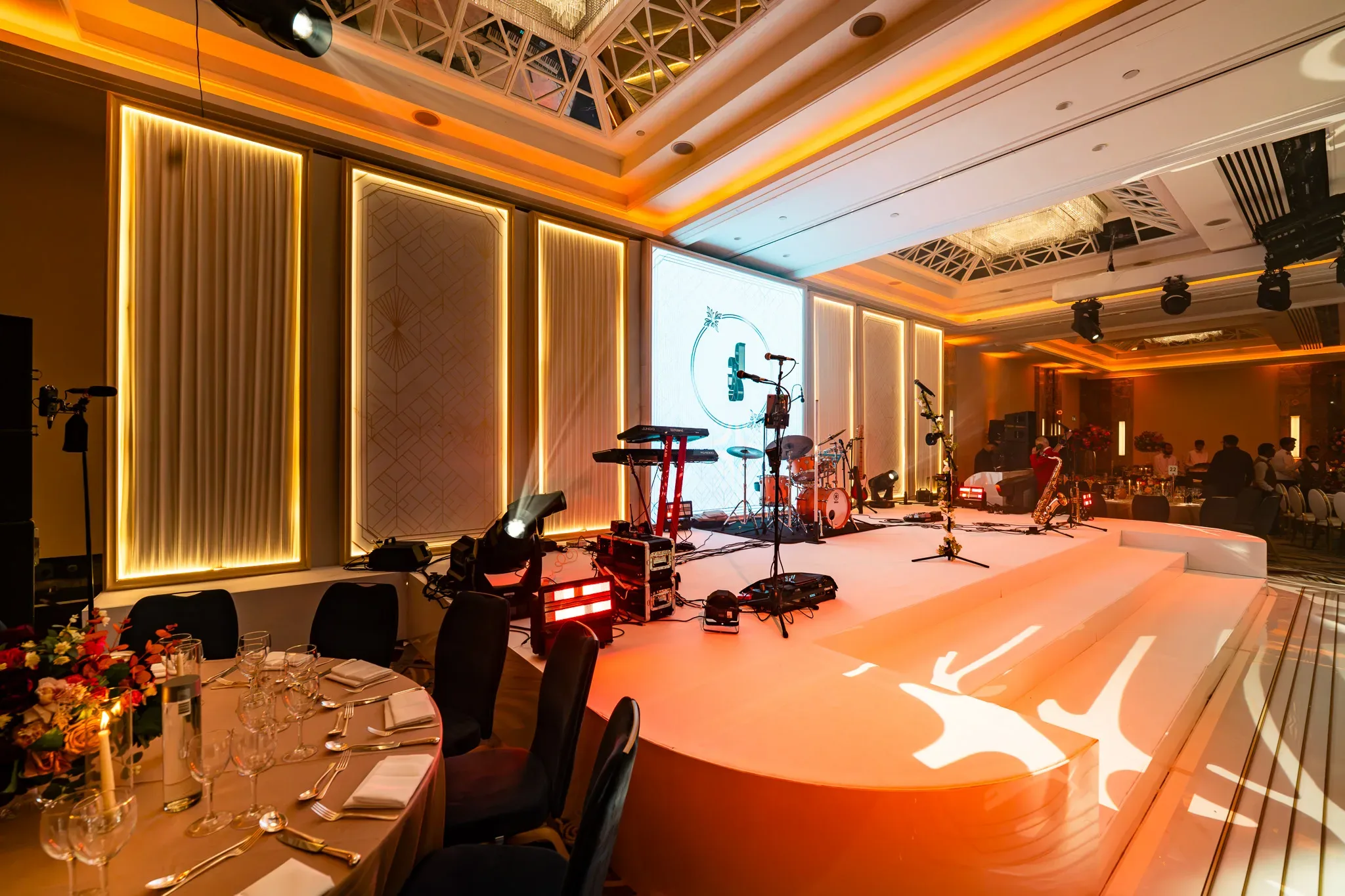 A personal backdrop | Royal Lancaster London | Kudos Music Pooja and Gary’s monogram on the central screen, framed by warm illuminated panels on the wedding stage.