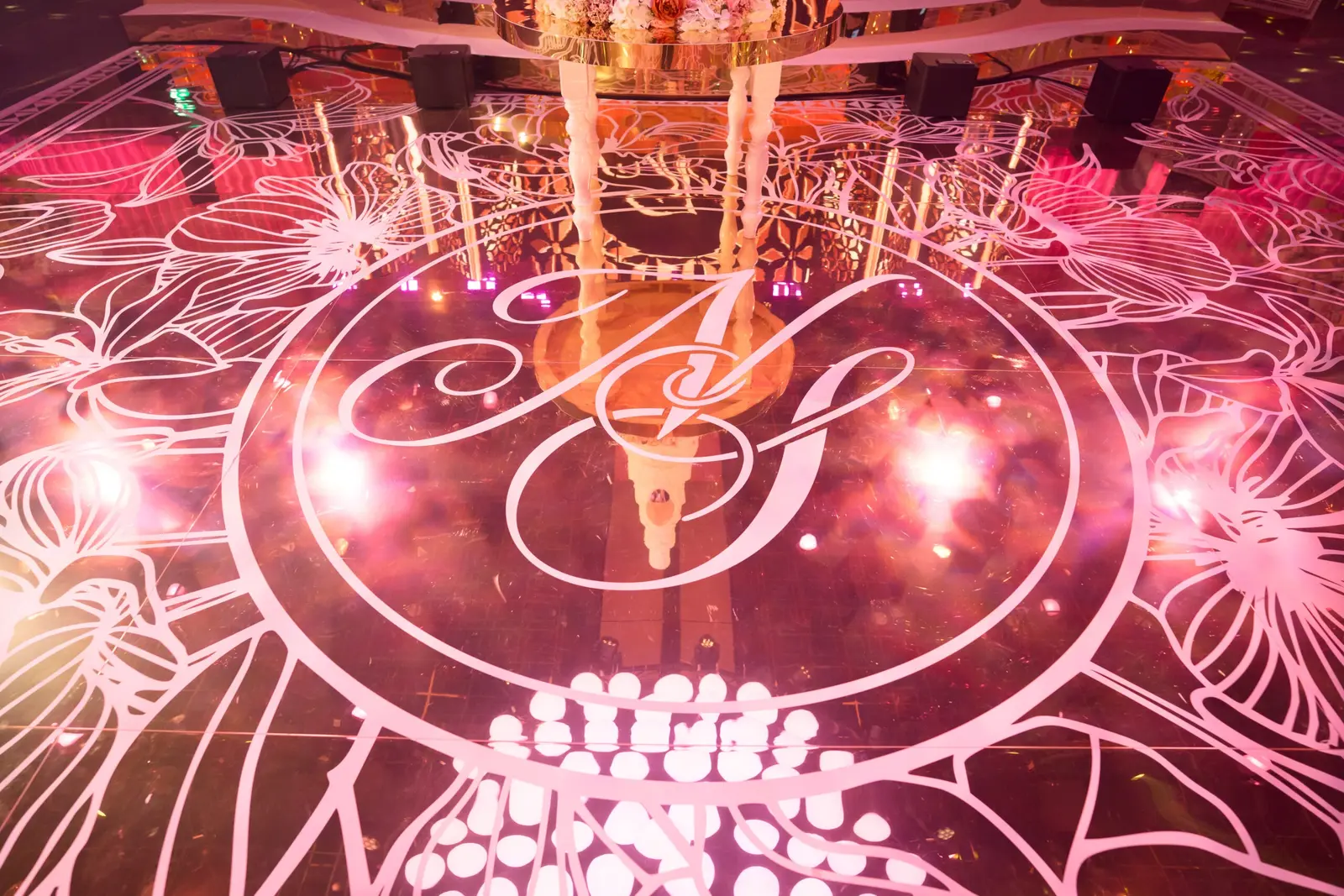 Close view of the printed monogram on the mirror dancefloor at The Londoner