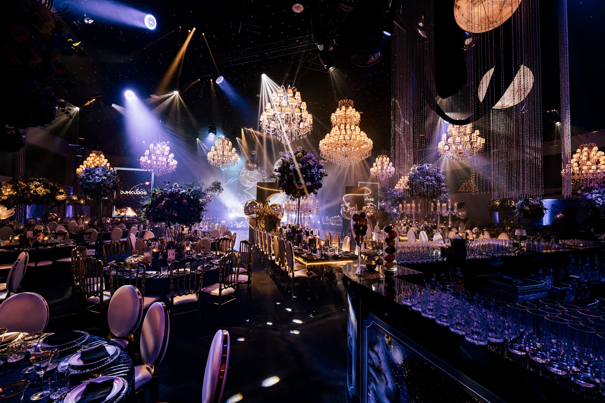 The stage lit for Jazzy B's live set, seen over the dinner tables at Charan and Puneet's Dallas Burston wedding, Kudos Music