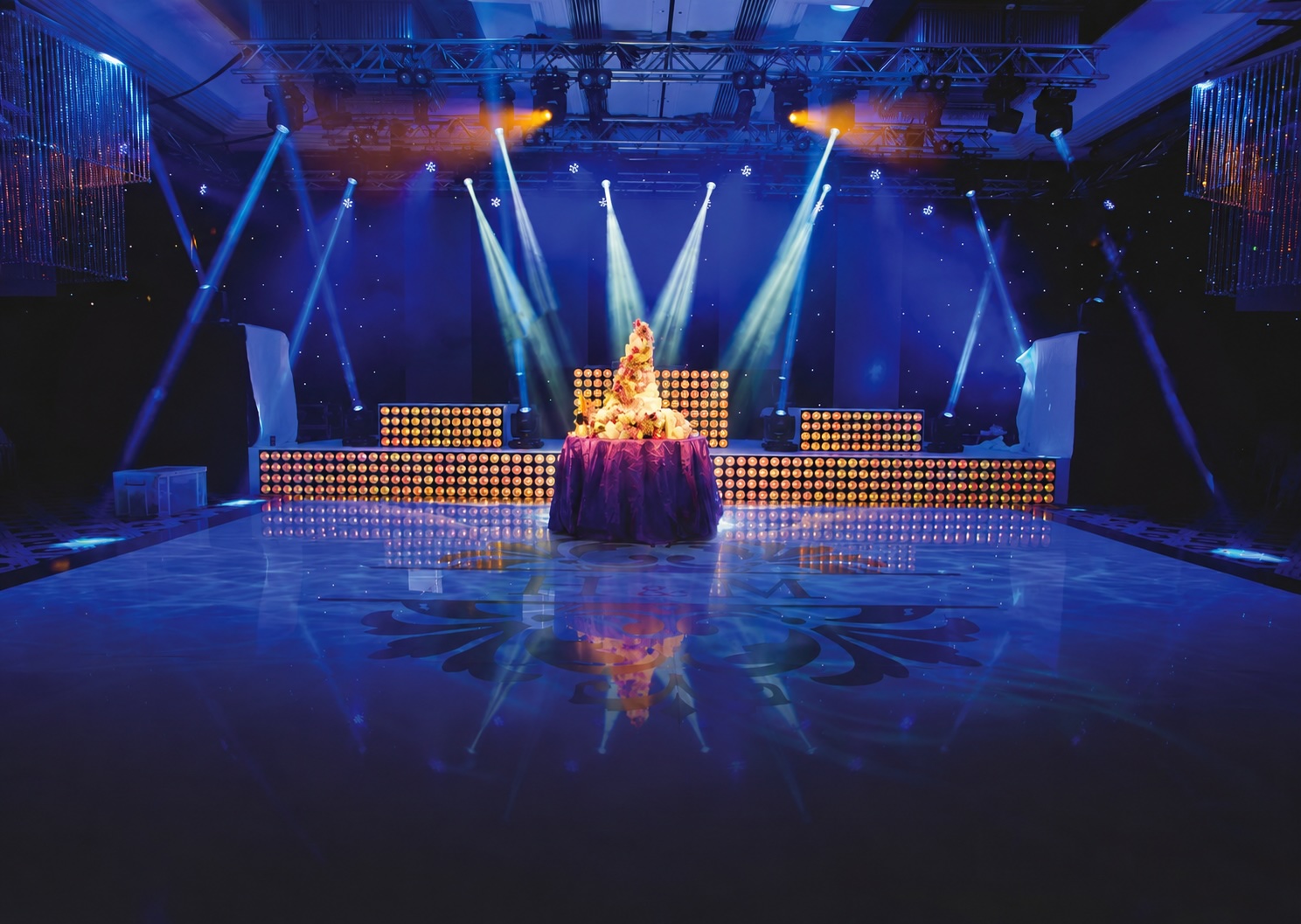 Wedding stage, set, lighting and printed dancefloor by Kudos Music at the Hilton NEC, Birmingham